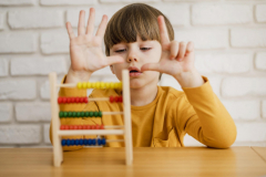 front-view-child-using-abacus-learn-how-count-scaled